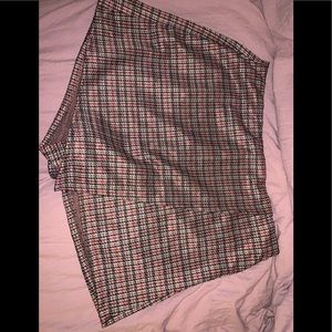 Beige skort with black and red detailing